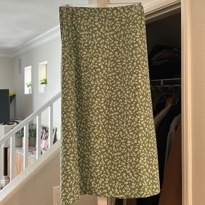 Cute A line midi skirt. Covers the knees. Light, airy green flowered skirt.